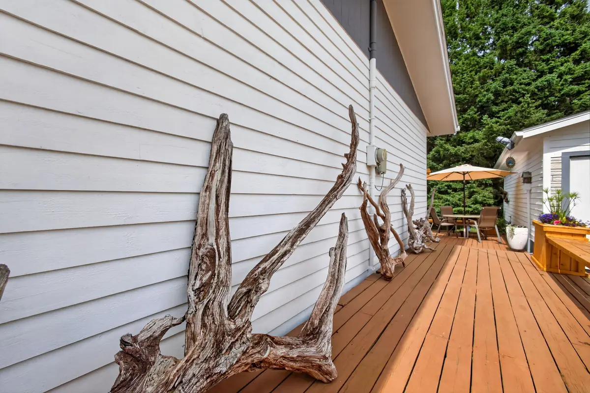 Beverly's driftwood pieces displayed along the deck