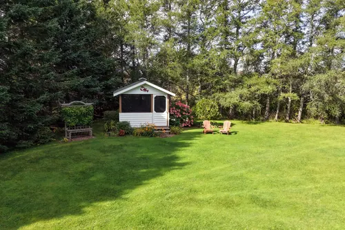 The gazebo at the far end of the back lawn