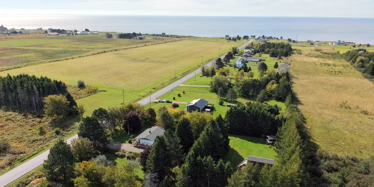 Mont Carmel Road from the air, with the property among the trees and the water at the end of the road